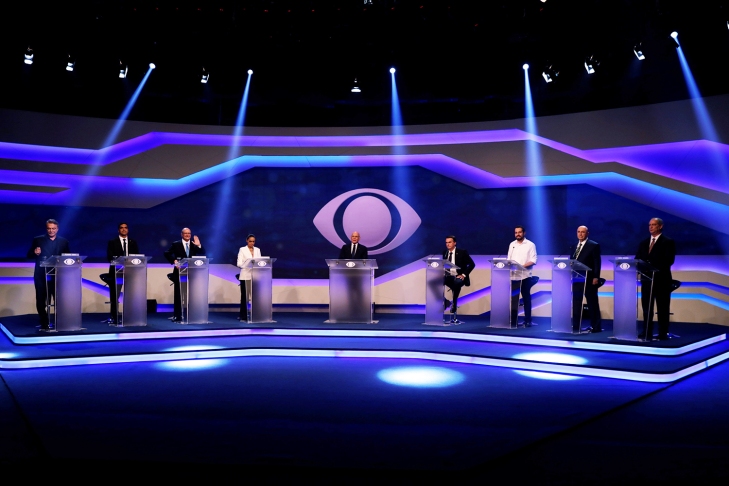 Presidential candidates are seen during their first televised debate at the Bandeirantes TV studio in Sao Paulo